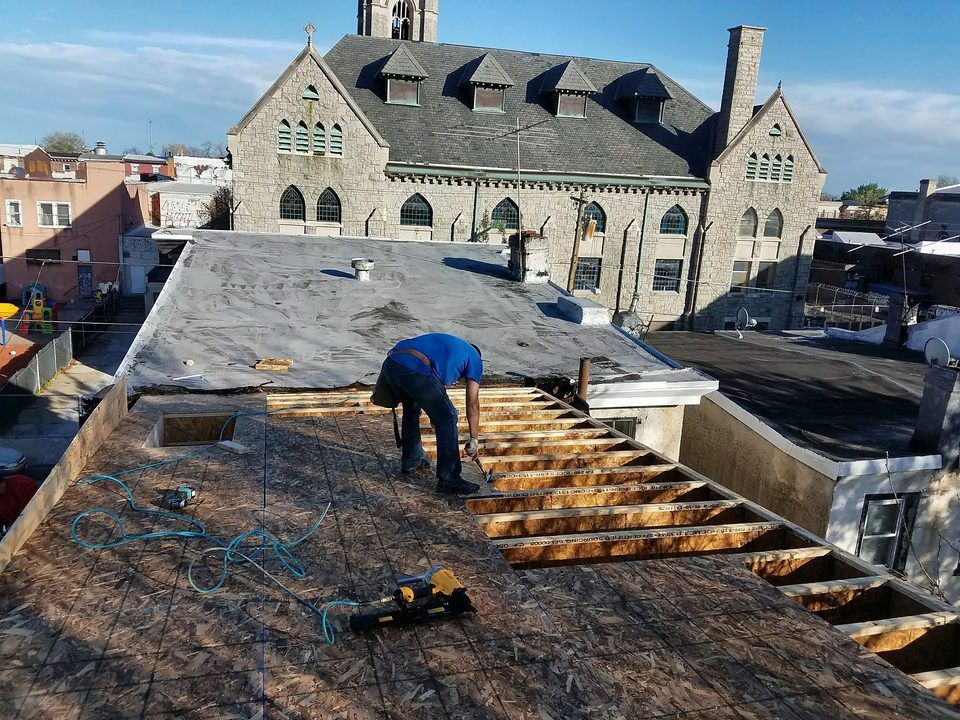 Flat-roof deck rebuild - Rotted decking replaced before new roofing